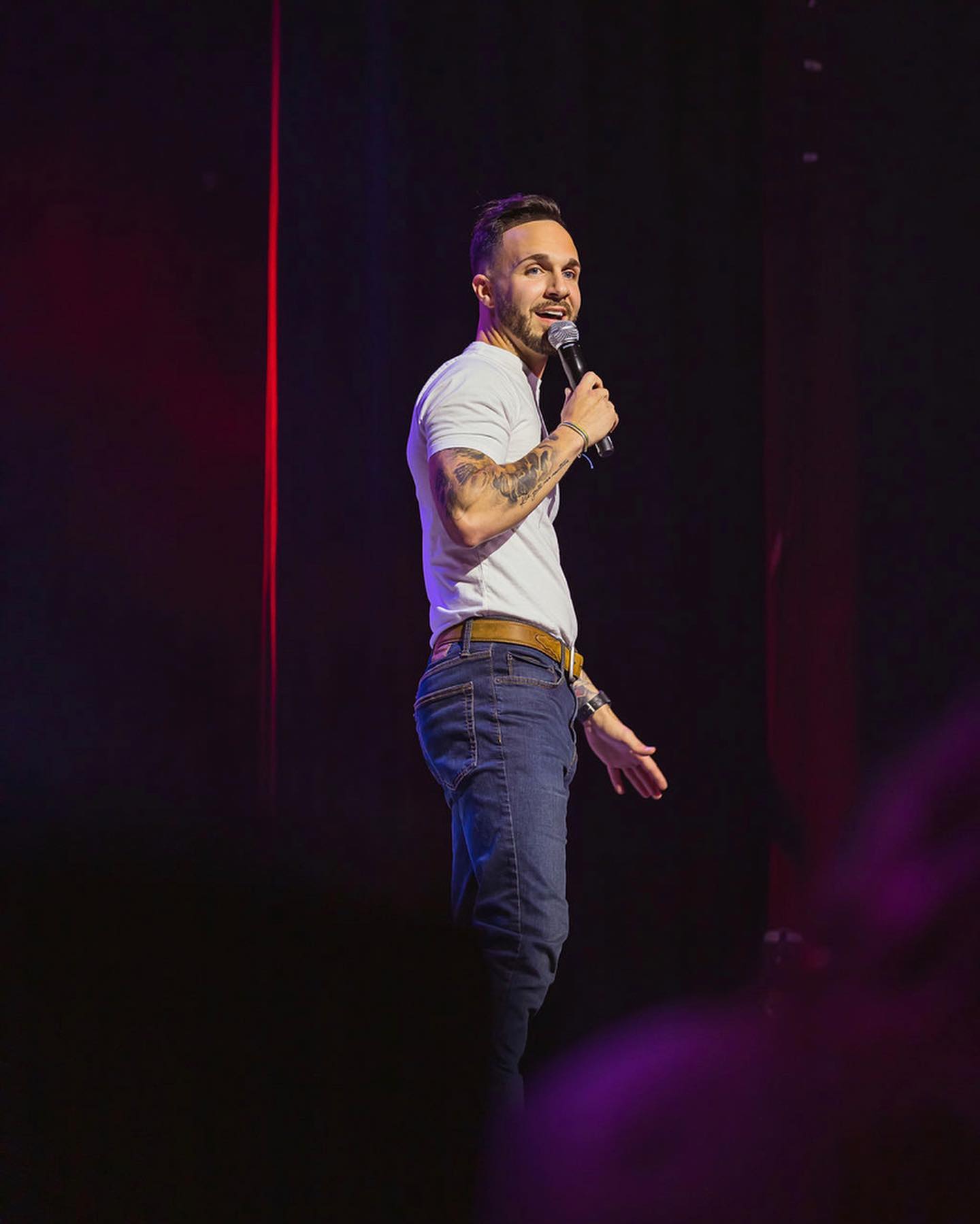 Cody performing with purple lights